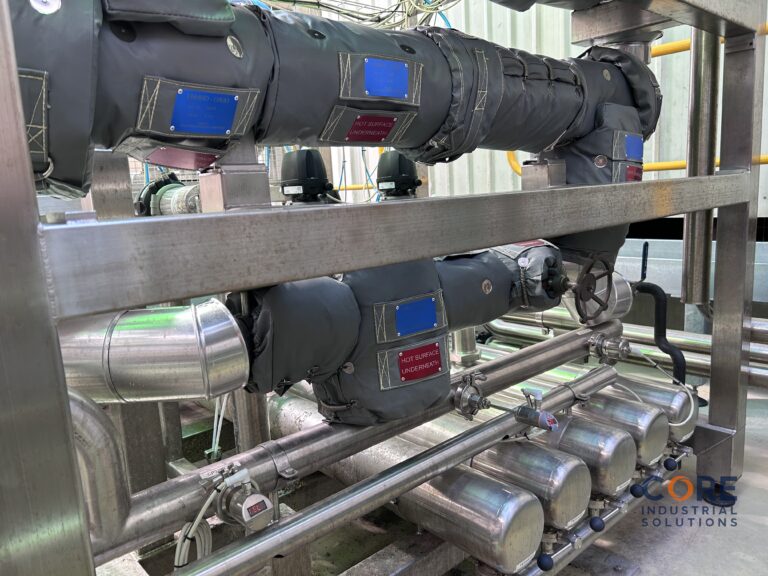 Overhead process piping system fitted with insulation covers