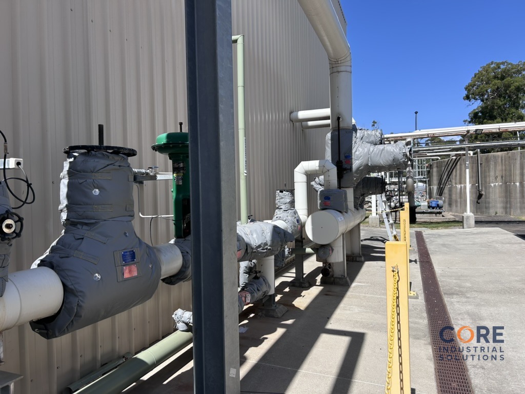 Industrial process piping fitted with insulation system outside facility
