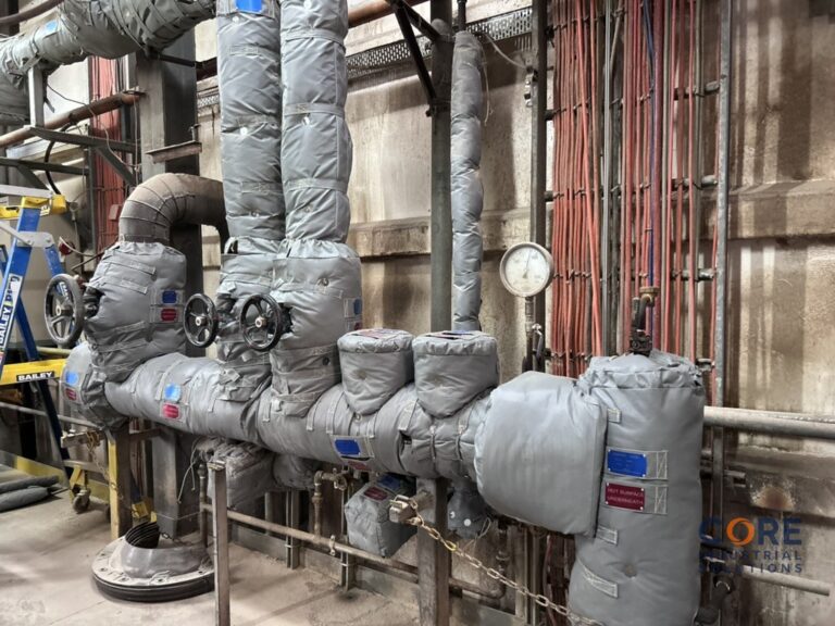 Steam pipe system fitted with insulation covers and pressure gauge