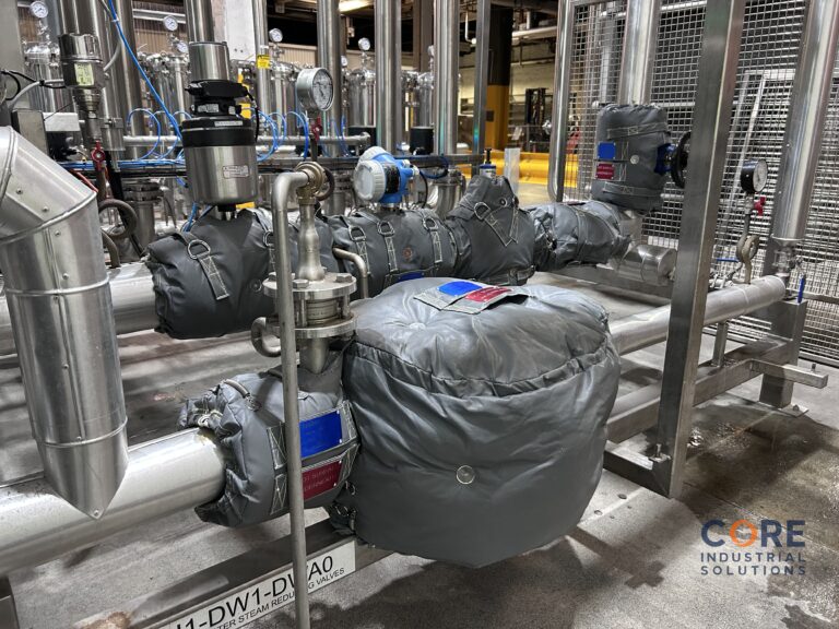 Insulation blanket system installed on industrial vessel