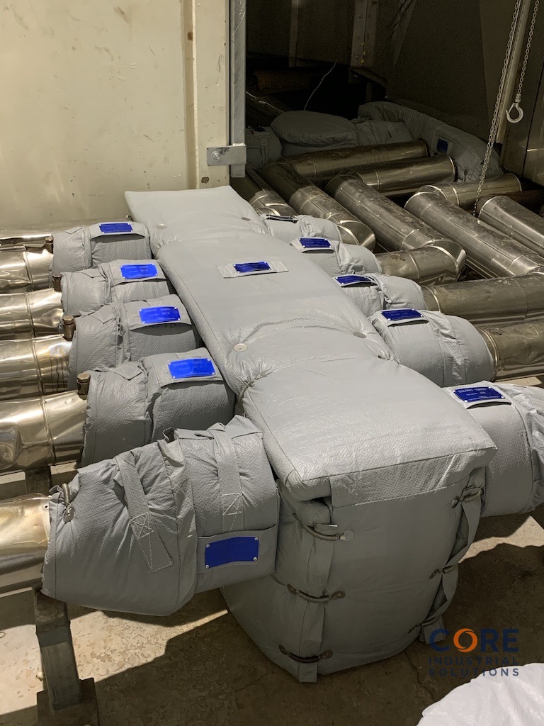 Industrial piping system fitted with multiple removable insulation covers